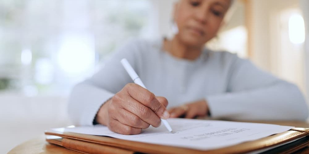 Person writing notes with white pen.